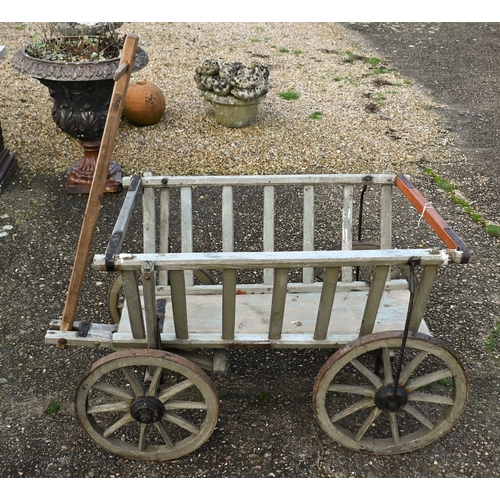 314 - A vintage wooden dog cart, with four steel banded wood spoke wheels, a/f