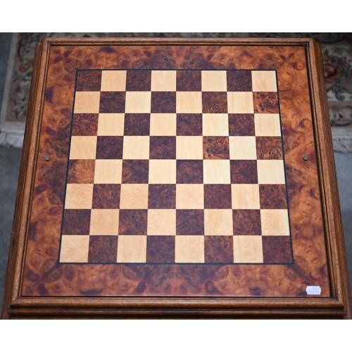 337 - A walnut inlaid games table for chess, cards and backgammon 62 cm square to/w a boxed games compendi... 