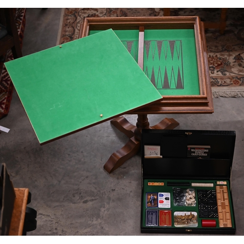 337 - A walnut inlaid games table for chess, cards and backgammon 62 cm square to/w a boxed games compendi... 