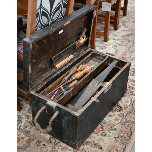 340 - A stained wood box containing a quantity of vintage tools