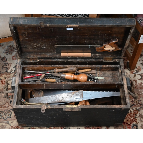 340 - A stained wood box containing a quantity of vintage tools