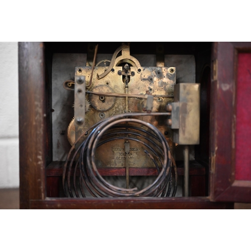 345 - An antique German inlaid mahogany lancet-cased mantel clock with silvered dial, striking and chiming... 