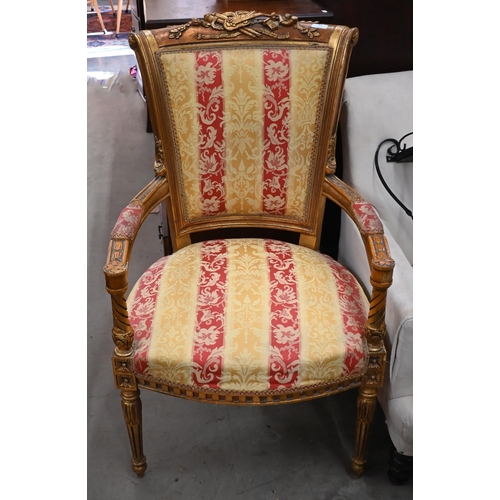 43 - A French style giltwood framed fauteuil armchair, floral and foliate striped damask fabric