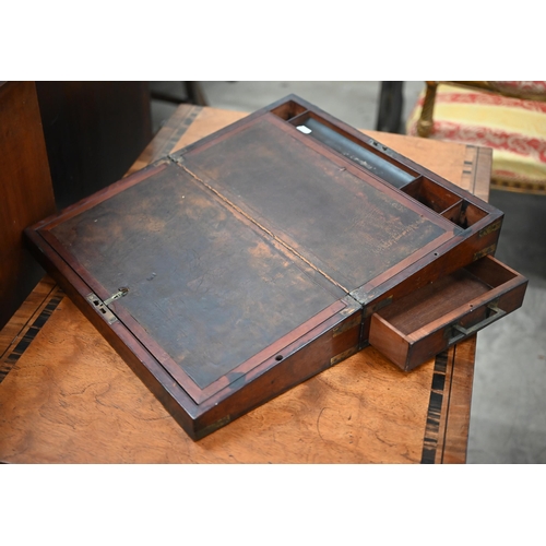 451 - A George IV brass-bound mahogany writing slope with fitted interior and base drawer, 46 cm wide