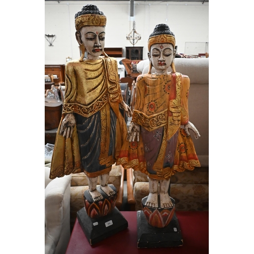 460 - Two Burmese carved and painted wood figures, 105/99 cm high (2)