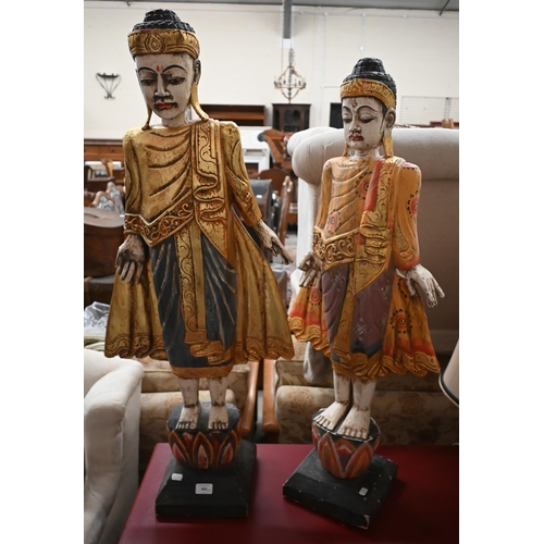 460 - Two Burmese carved and painted wood figures, 105/99 cm high (2)