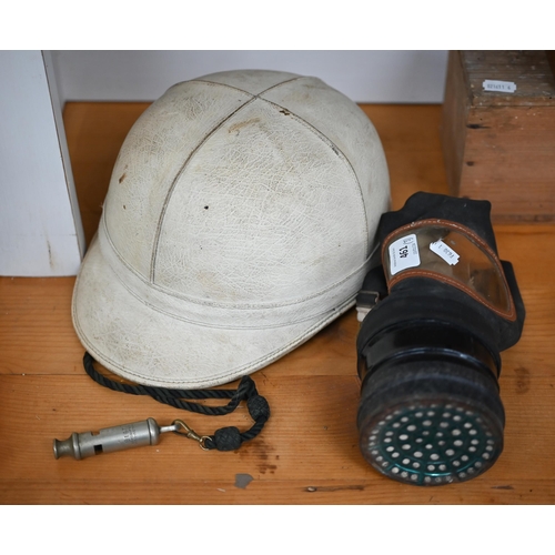 461 - A vintage Waddington's 'Topper' motorcyclist's crash-helmet to/w a gas-mask and a whistle dated 1916... 