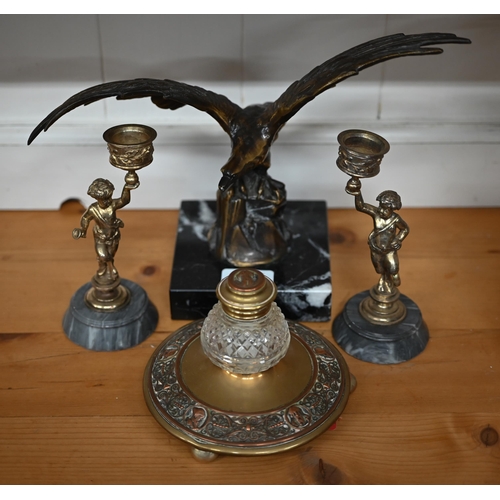 466 - A bronze spread eagle on marble base 29 cm wide to/w a brass and glass inkwell and a pair of Bacchan... 