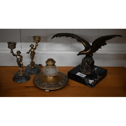 466 - A bronze spread eagle on marble base 29 cm wide to/w a brass and glass inkwell and a pair of Bacchan... 