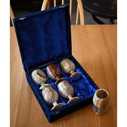 483 - A cased set of six turned onyx goblets