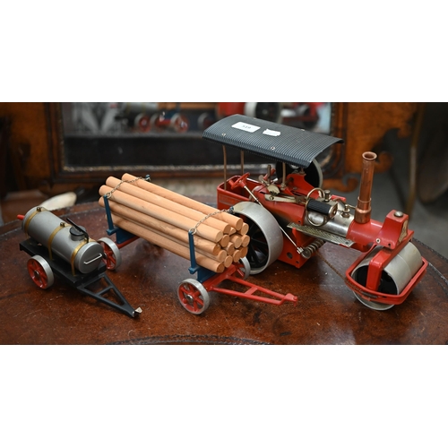 519 - A German Wilesco model steam-roller, c/w water-bowser and log trailer (replacement chimney)