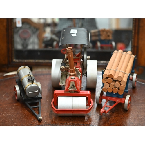 519 - A German Wilesco model steam-roller, c/w water-bowser and log trailer (replacement chimney)