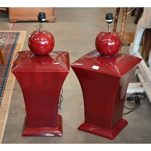 526 - A large pair of puce-glazed ceramics table lamps, 73 cm high overall