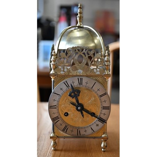 528 - A brass reproduction lantern clock with twin-train movement, 33 cm high