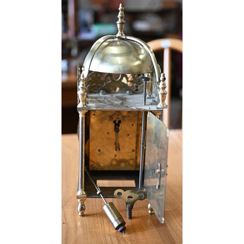 528 - A brass reproduction lantern clock with twin-train movement, 33 cm high