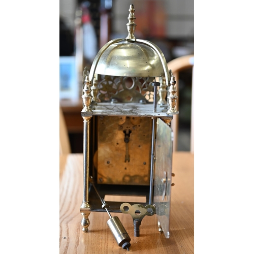 528 - A brass reproduction lantern clock with twin-train movement, 33 cm high