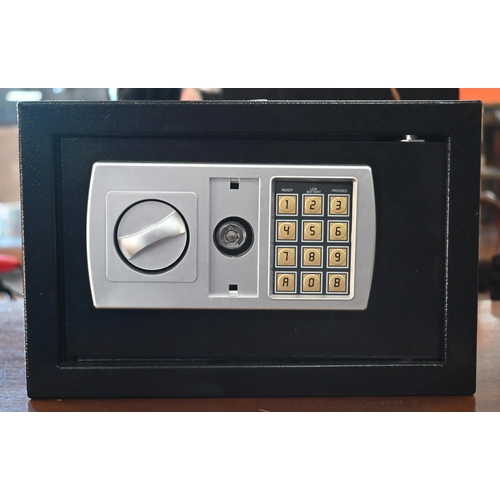 530 - A small safe with digital combination lock (master key in office), 31 x 20 x 20 cm