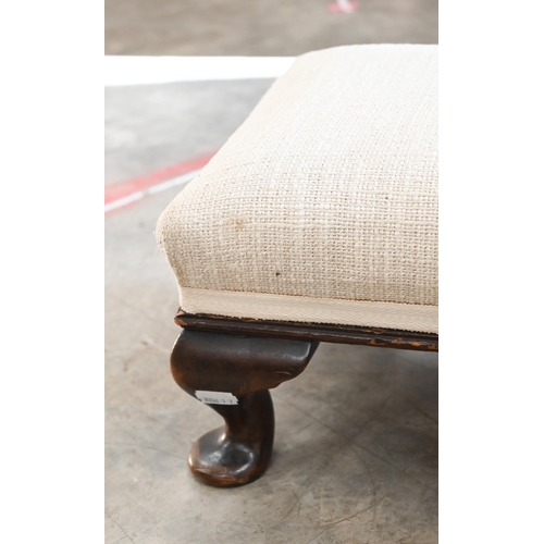 531 - An Edwardian oak fender stool with upholstered top on cabriole supports, 132 cm