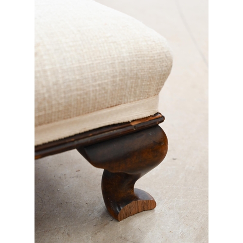 531 - An Edwardian oak fender stool with upholstered top on cabriole supports, 132 cm