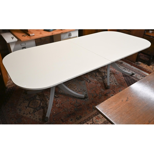 540 - A painted twin-pedestal extending dining table with single central leaf, 320 x 115 x 76 cm high