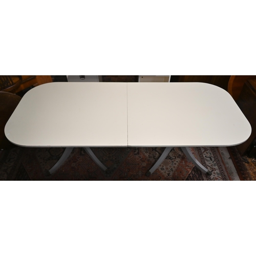 540 - A painted twin-pedestal extending dining table with single central leaf, 320 x 115 x 76 cm high