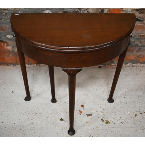 548 - A Georgian mahogany and oak folding demi lune tea table, 75 cm wide x 38 cm deep x 72 cm high