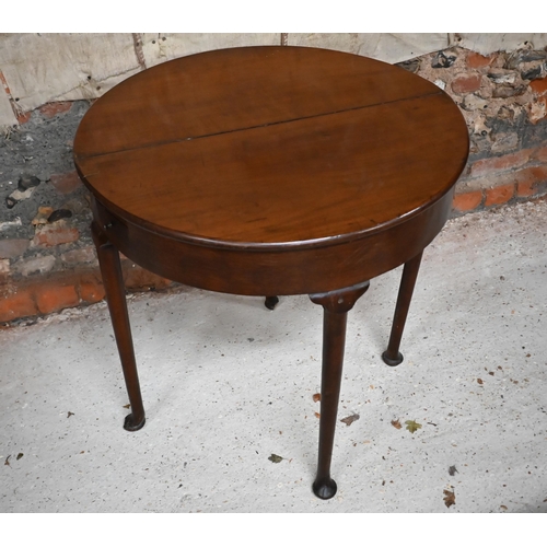 548 - A Georgian mahogany and oak folding demi lune tea table, 75 cm wide x 38 cm deep x 72 cm high