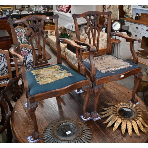 63 - A set of mahogany Chippendale-style dining chairs with ball and claw feet and sabre back legs, with ... 