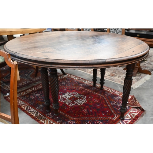 66 - A 19th century mahogany circular campaign dining table on spiral turned supports (can be separated/u... 