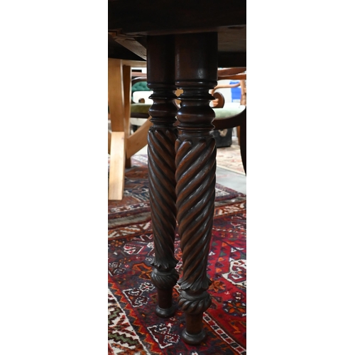 66 - A 19th century mahogany circular campaign dining table on spiral turned supports (can be separated/u... 