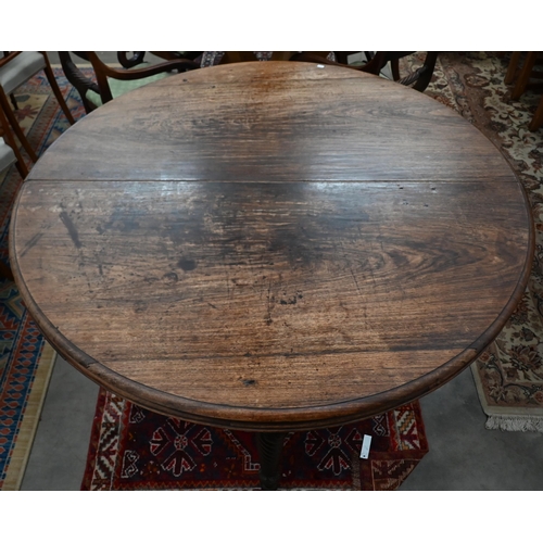 66 - A 19th century mahogany circular campaign dining table on spiral turned supports (can be separated/u... 