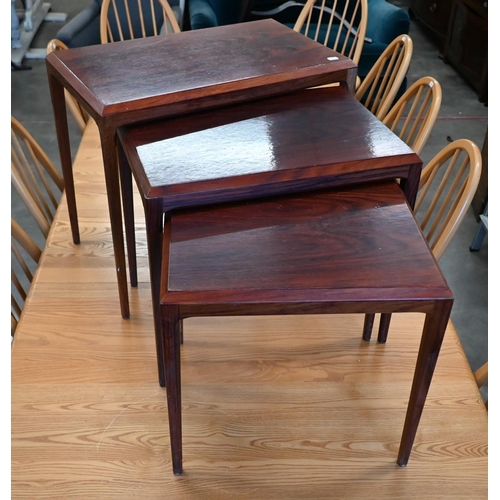 71 - A nest of three mid-century rosewood tables, the largest 60 cm wide x 36 x 50 cm high