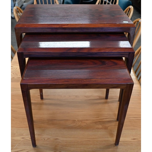 71 - A nest of three mid-century rosewood tables, the largest 60 cm wide x 36 x 50 cm high