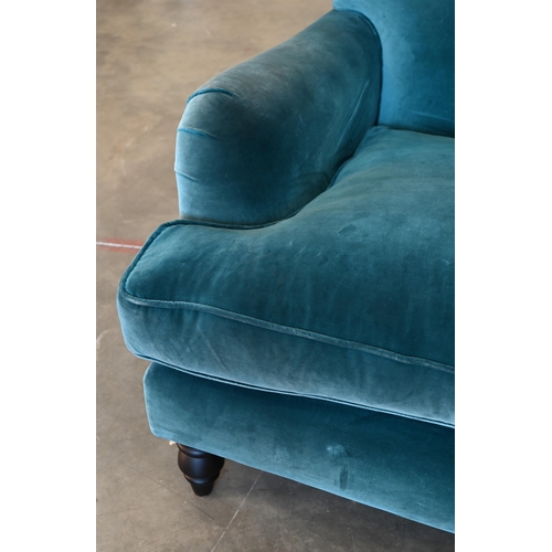 75 - A Howard stye love seat in peacock blue velour fabric, ebonised turned front supports, 140 x 100 x 9... 