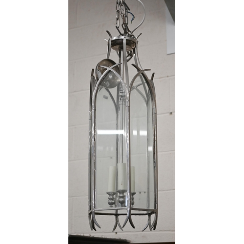 86 - A large Gothic-style three light pendant lantern, with six lancet glass panels and suspension chain,... 