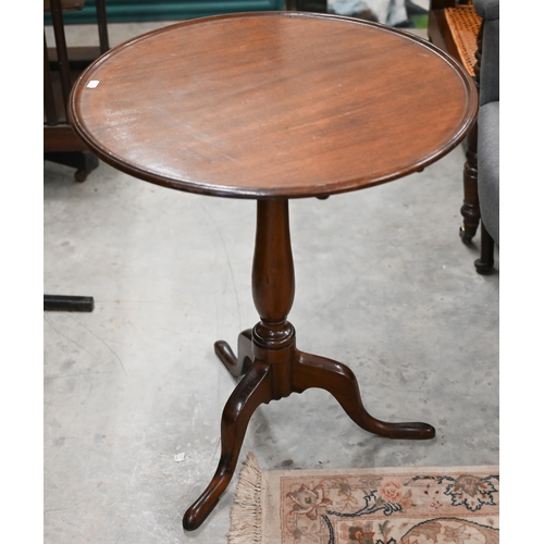 87 - A 19th century mahogany circular tilt-top occasional table on turned column and triform supports, 62... 