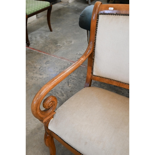 90 - # A stained beech framed salon settee with open scroll arms, champagne dralon upholstery