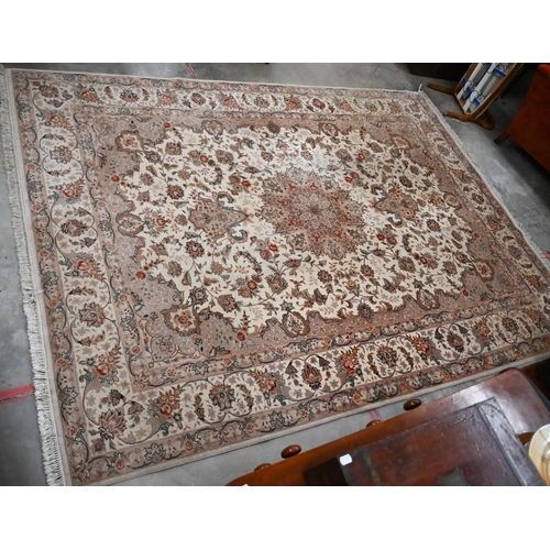 91 - A Chinese cream ground carpet with traditional Persian sylised floral design, 356 x 256 cm (treated ... 