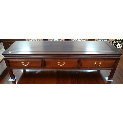 92 - A 20th century Chinese stained hardwood rectangular coffee table with three drawers, 150 x 50 x 44 c... 