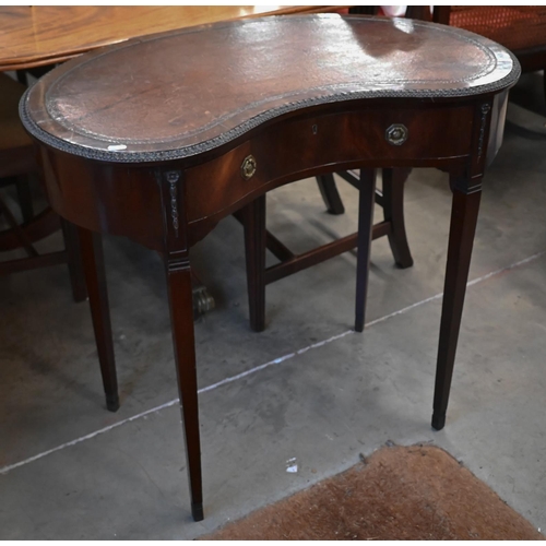 94 - An Edwardian mahogany kidney-shaped writing table with tooled brown leather top and single frieze dr... 