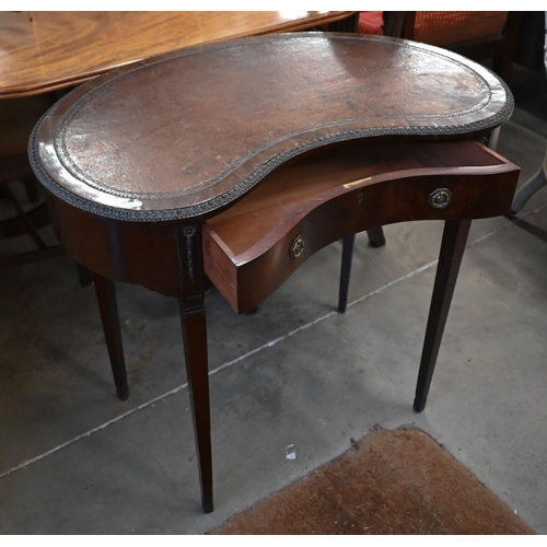 94 - An Edwardian mahogany kidney-shaped writing table with tooled brown leather top and single frieze dr... 