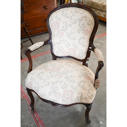 95 - A French Louis XV style fauteuil armchair with foliate upholstery