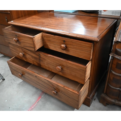 97 - A 19th century mahogany low chest of two short over two long drawers with turned handles, raised on ... 