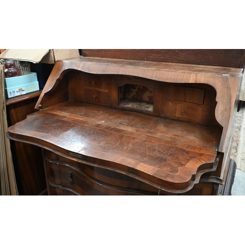 99 - # An antique Continental walnut fall front bureau with three long drawers standing on shaped bracket... 