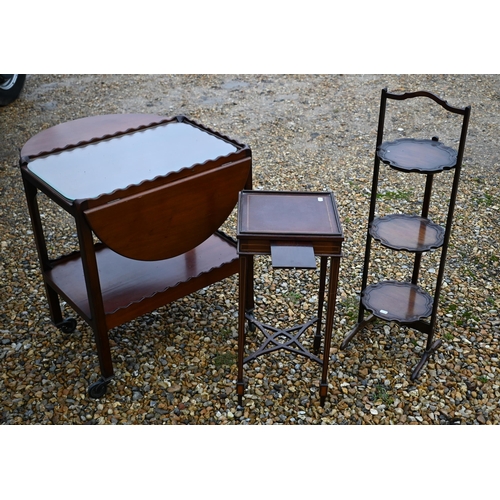 202 - A vintage three-tier folding cake-stand to/with a traditional tea trolley and a Sheraton Revival gal... 