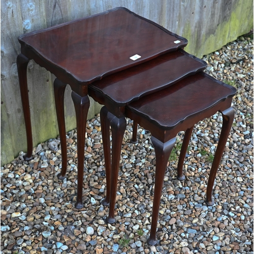 538 - A nest of three mahogany tables on cabriole legs with pad feet