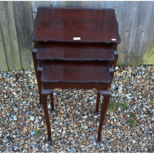 538 - A nest of three mahogany tables on cabriole legs with pad feet