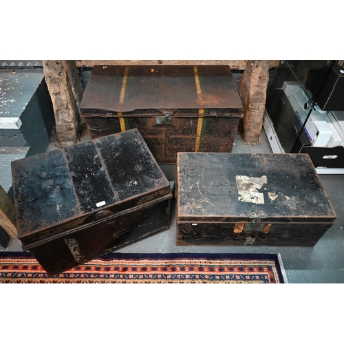 556 - A stack of three antique and later japanned steel military uniform trunks, all a/f (3)