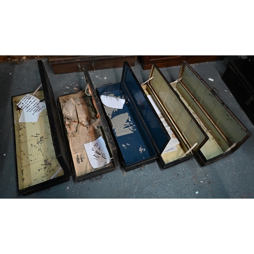 557 - A stack of five antique and later japanned steel military uniform/transit trunks, variously labelled... 