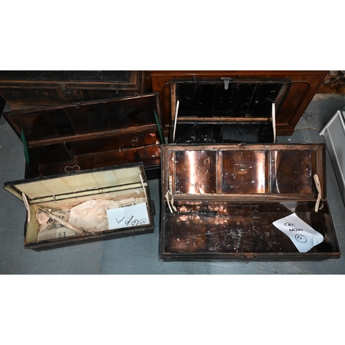 560 - A stack of four antique and later japanned steel military uniform trunks, variously labelled incl. T... 